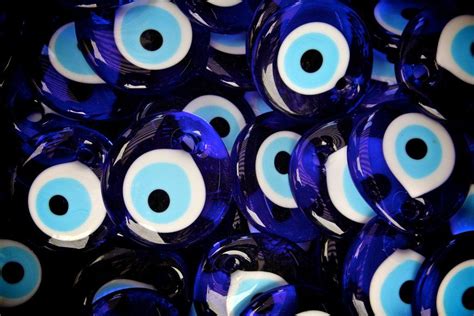 Evil Eye Meaning And The History Of Protection Evil Eye Jewelry Turkish Eye Evil Eye Blue