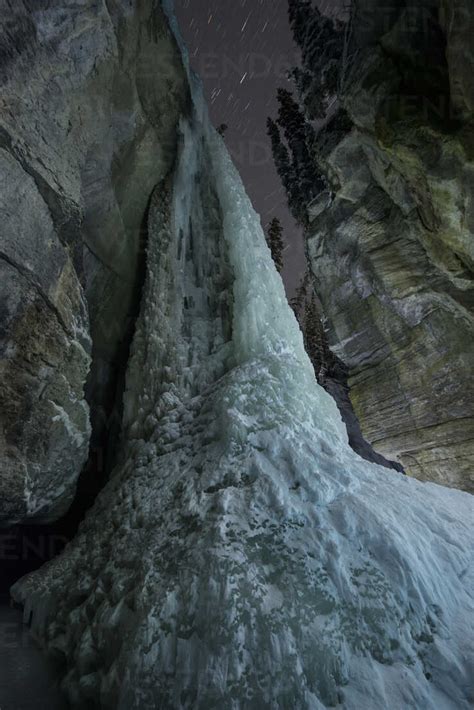 Low Angle View Of Frozen Waterfall At Maligne Canyon Stock Photo