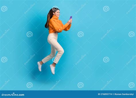 Full Length Profile Portrait Of Carefree Girl Jump Run Use Telephone