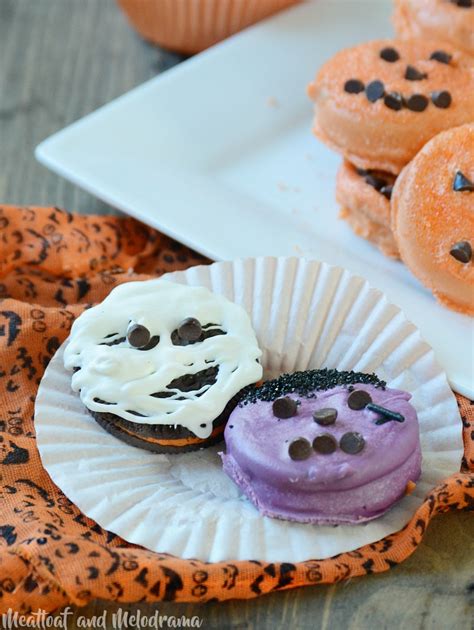 Place two candy eyes, two chocolate chip ears, a heart sprinkle nose, and six whiskers on . Halloween Oreo Pumpkin Treats - Meatloaf and Melodrama