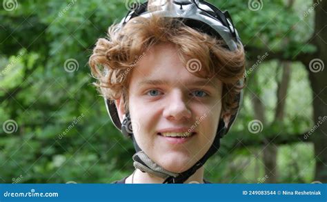 Portrait Of A Handsome Teenage Boy With Red Hair And Blue Eyes In A