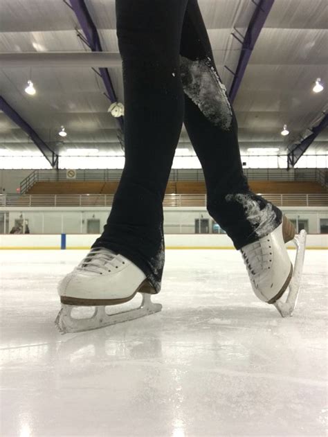 Graceful Ice Skater In Action