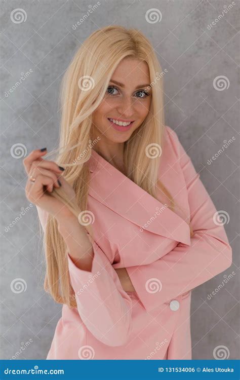 Sweet Sensual Blonde Girl In Pink Fashionable Clothes Smiling And