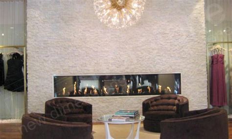 The white tiled floor and whiteness of the stone and walls gives this a unique look. White Quartz rock panel Fireplace/Feature Wall | Staxstone ...