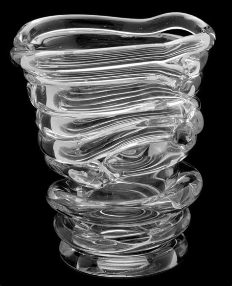 A Glass Vase Sitting On Top Of A Black Table