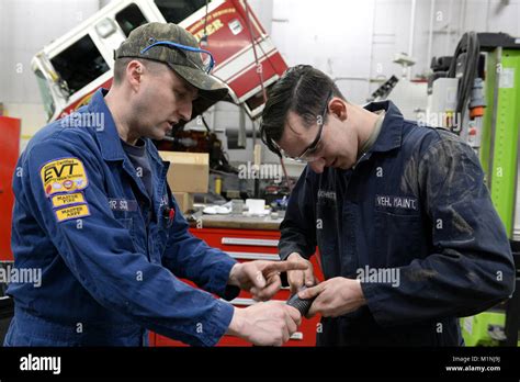 Oral Scott Lead Fire Truck Mechanic Teaches Airman 1st Class Nicholas