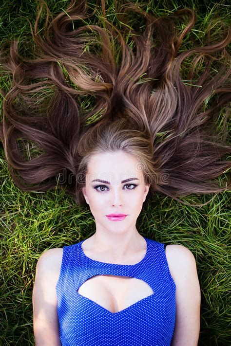Portrait Of Girl In Blue Dress In Garden On Grass Stock Photo Image