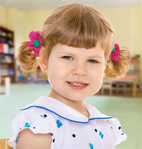 Beautiful Little Girl In Holding A Bouquet Stock Photo Image Of