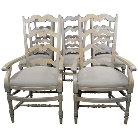 Upholstery of white fabric has a colourful striped design. Set of 6 Antique French Country Carved Oak Ladder Back ...