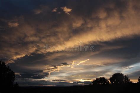 Spectacular Sky Scene With The Sunsetting In The West Stock Photo