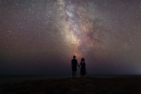 Couple Near The Sea Under The Starry Sky Stock Photo Download Image