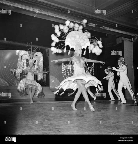 Paris Lido Feature Cabaret Dancers Perform On Stage At A Night Club In