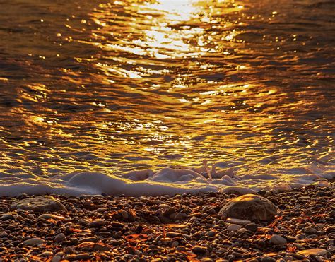Shining Sunset Pebbles 2 Photograph By Iordanis Pallikaras Fine Art