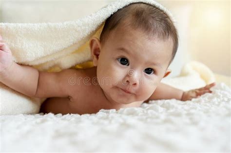 Cute Baby Looking At Camera Under White Blanket Innocence Baby