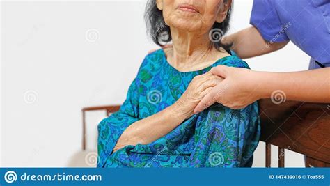 Elderly Woman Holding Hand With Caregiver Stock Photo Image Of
