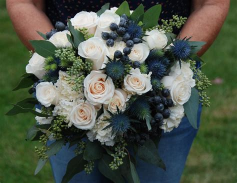 Blue And Ivory Brides Bouquet Ivory Vendela Roses Blue Thistle