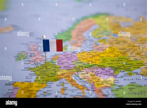 Flag Pin Placed On World Map In The Capital Of France Paris Stock Photo