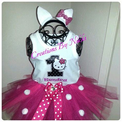 A Dress Made To Look Like A Hello Kitty Outfit With Pink And White