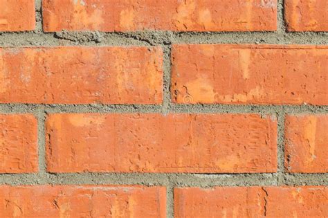 Colorful Orange Brick Wall Background In A Flemish Stretcher Bond