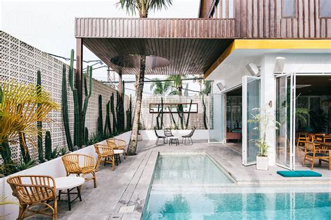 Bamboo Furniture Near Swimming Pool In Stylish Tropical Beach Club By