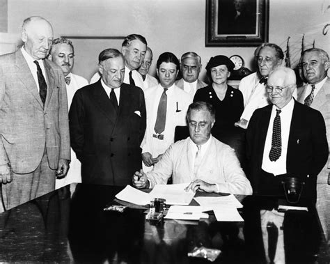 social security act 1935 npresident franklin d roosevelt signing the social security act in