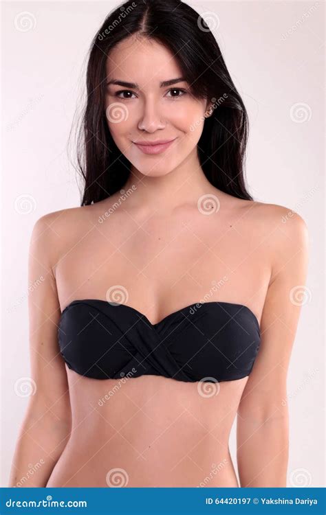 Beautiful Woman With Perfect Body With Dark Straight Hair Wears Black Bikini Stock Photo
