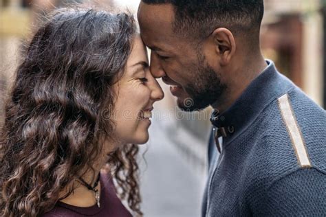 Happy Young Interracial Couple Kissing Stock Image Image Of Closeness