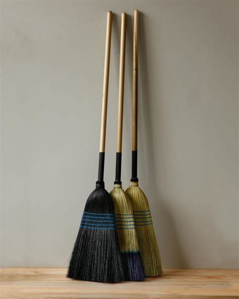 Take a thick loop of ribbon and tie it through the hole. Barn Brooms - Lostine