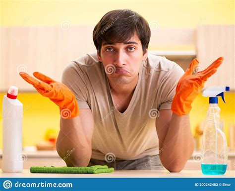 single man cleaning kitchen at home stock image image of cleaner bottle 200242483