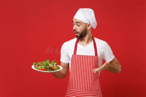 Shocked Young Bearded Male Chef Cook Or Baker Man In Striped Apron Toque Chefs Hat Posing