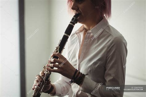 Beautiful Woman Playing A Clarinet In Music School — Caucasian