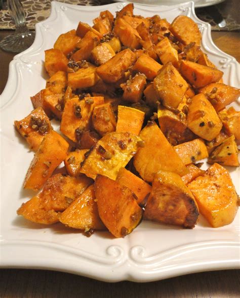 After baking, butter is added to the sweet potatoes and they're seasoned. Blissful Baking: Candied Sweet Potatoes