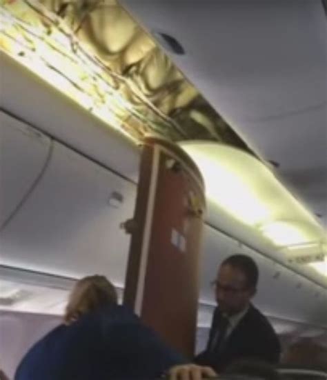 United Airlines Planes Ceiling Collapses On Passengers During Rough Landing Seen In Terrifying