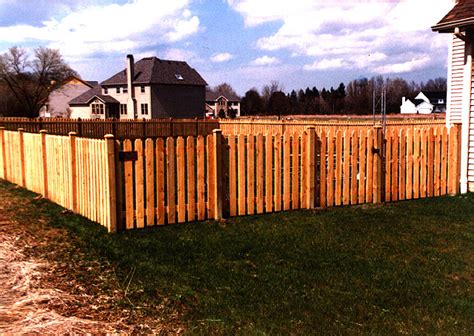 Spaced Classic Wood Picket Fence With Beveled Post Caps By Elyria Fence