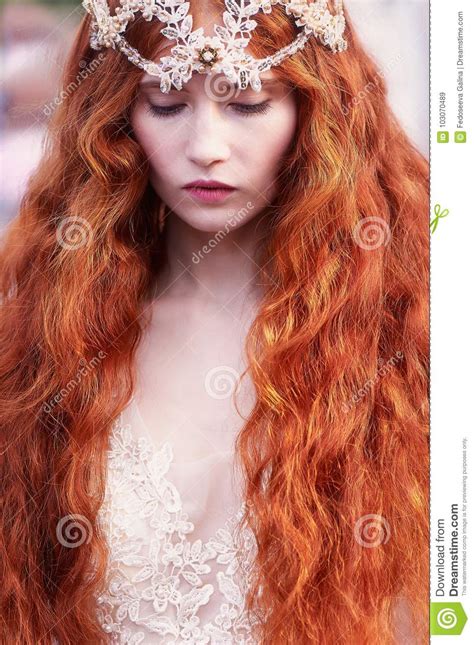 Beautiful Red Haired Girl With Long Curly Hair In The Bride In A Long