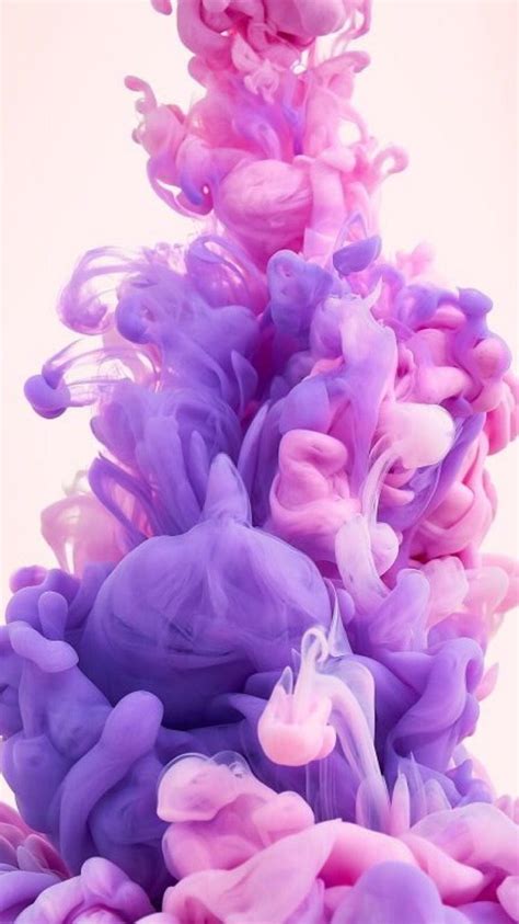 Purple And Pink Ink Floating In Water