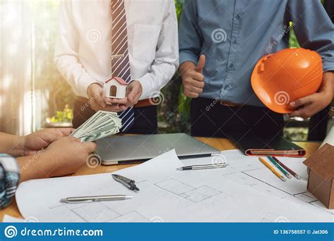 Engineer And Architect Concept Client Holding Money With Engineer