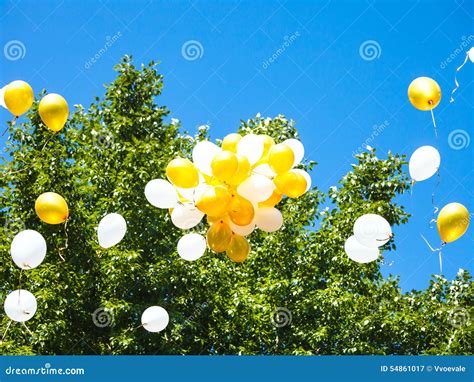 Bunch Of Balloons Rising In Blue Sky Stock Image Image Of Floating