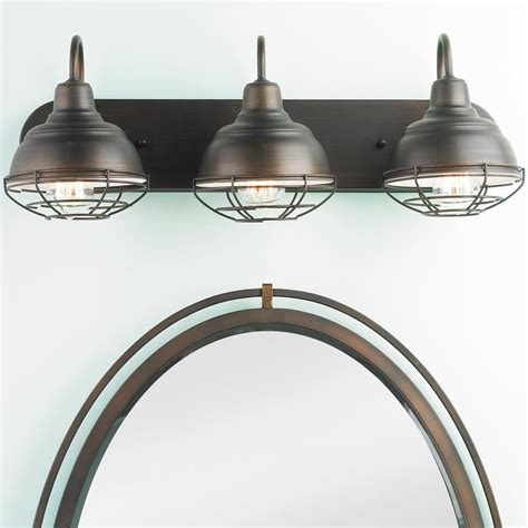 If your bathroom has a double vanity, you can also choose to mount two fixtures, one over each sink and mirror. Industrial Cage 3 Light Vanity Light | Vanity lighting ...