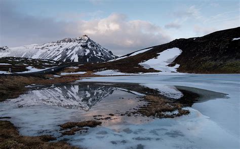 Typical Icelandic Dramatic Landscape With Frozen Lake And Mountains