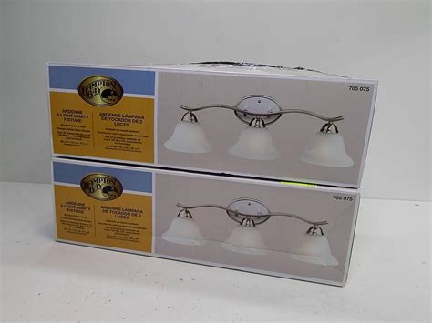 The metal shades with the white interiors provide ample light right where you need it. Lot 2 Hampton Bay 705075 Andenne 3 Light Vanity Fixture ...