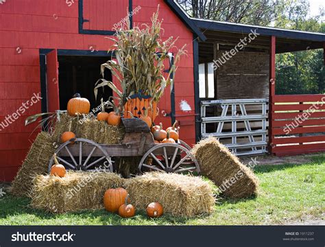 A Red Barn Decorated For Fall And Halloween And Thanksgiving Stock