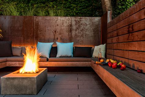Secluded Outdoor Conversation Pit Surrounded By A Wall Of Green