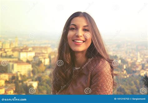 Young Confident Smiling Woman Looking At Camera Outdoor At Sunset Stock
