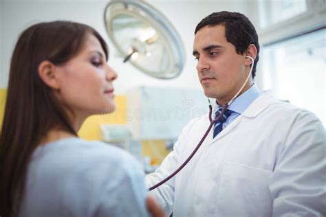 Doctor Examining A Female Patient Stock Photo Image Of Office