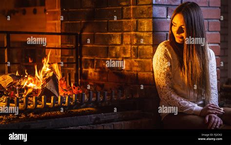 Melancholic Pensive Woman Relaxing Resting At Fireplace Thoughtful