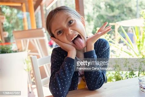 Girl Sticking Out Tongue Photo Getty Images