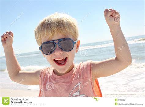 Young Child Flexing Muscles On Beach Stock Image Image