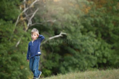 Blonde Boy Walking Alone And Sad In The Woods Stock Image Image Of
