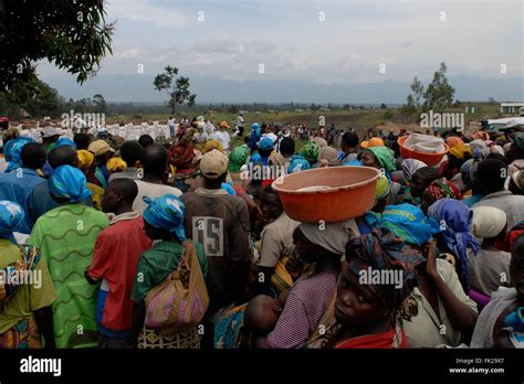 Internally Displaced People Wait For A Food Distribution Carried Out By